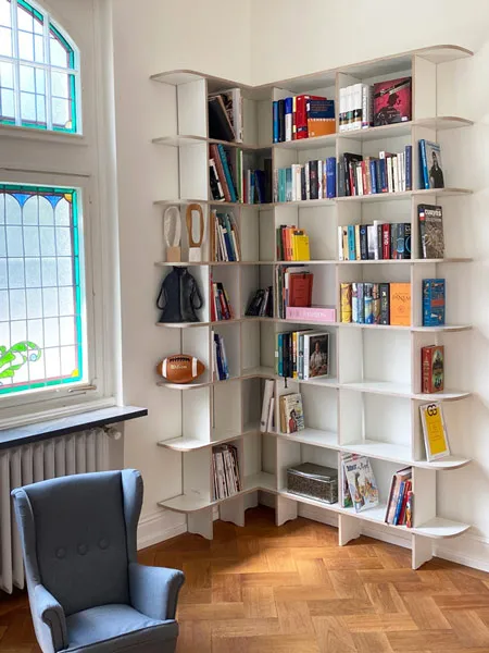 White corner shelf with books