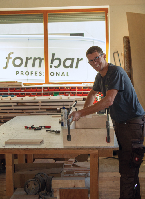 Carpenter Martin Bücherl works at the workbench