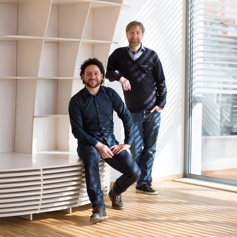 The founders in front of a form.bar shelf-bench combination