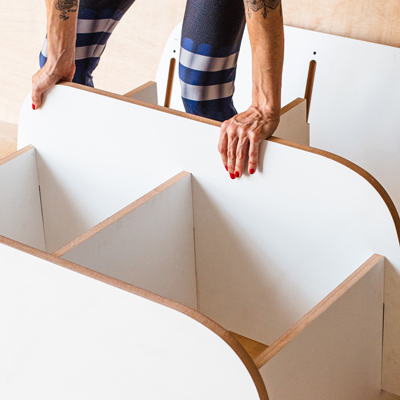 Woman assembles furniture