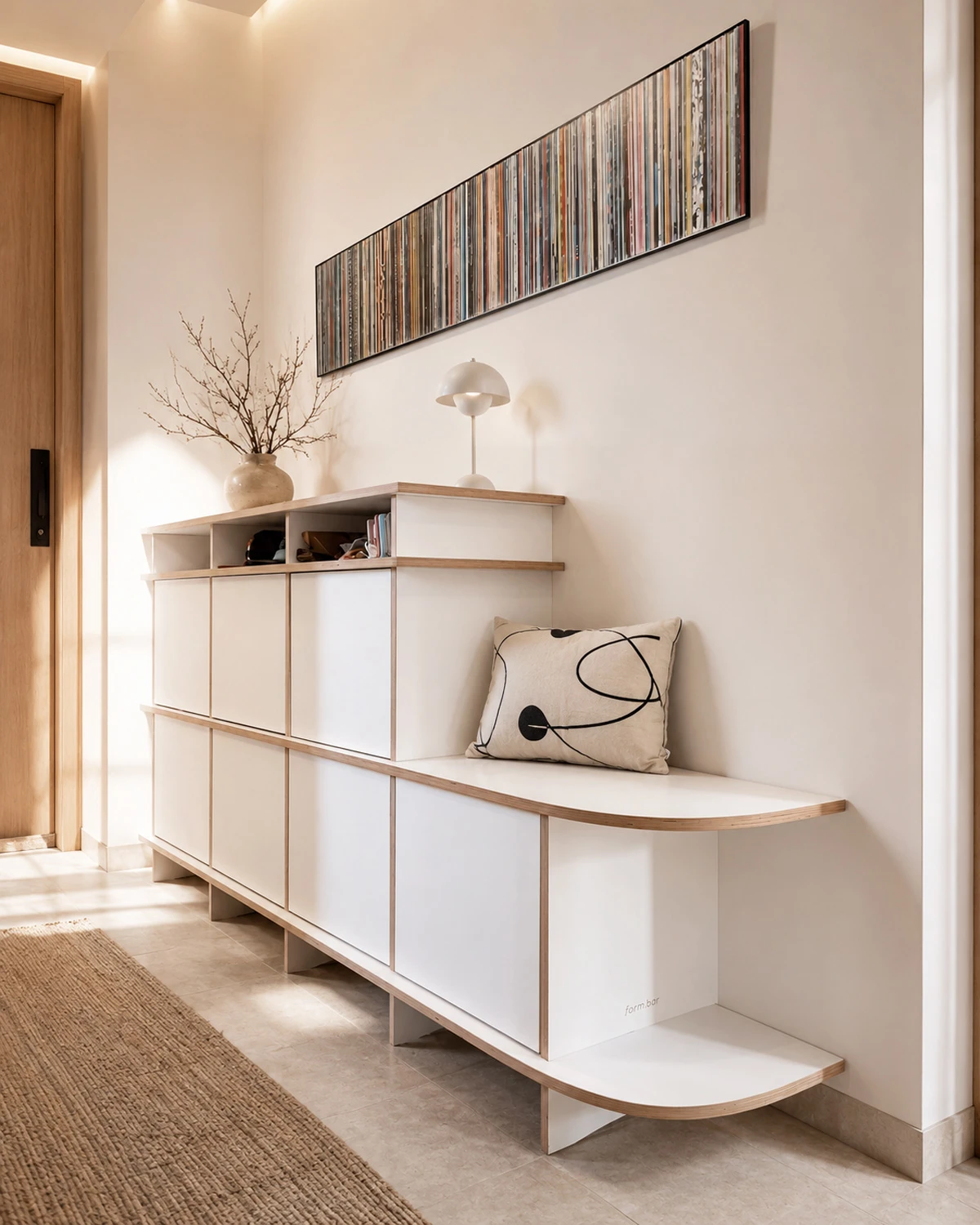 Two-level white hallway bench with storage, doors, wood edges, seating area and decor in a modern hallway