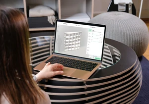 Woman configures shelf on laptop
